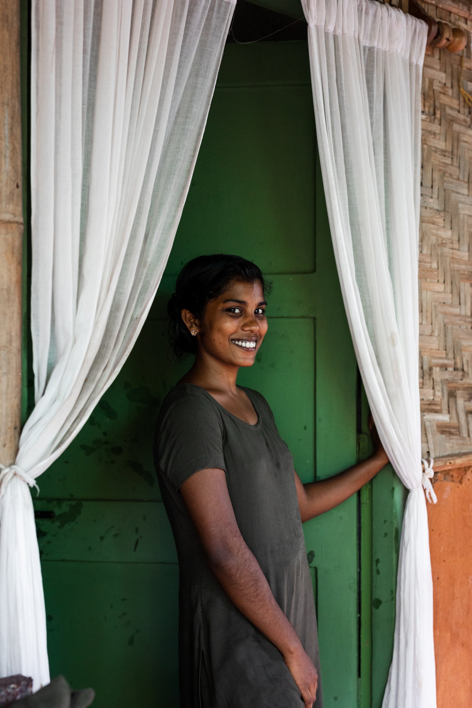 A SWAN Ayurveda therapist welcoming a guest at the treatment room